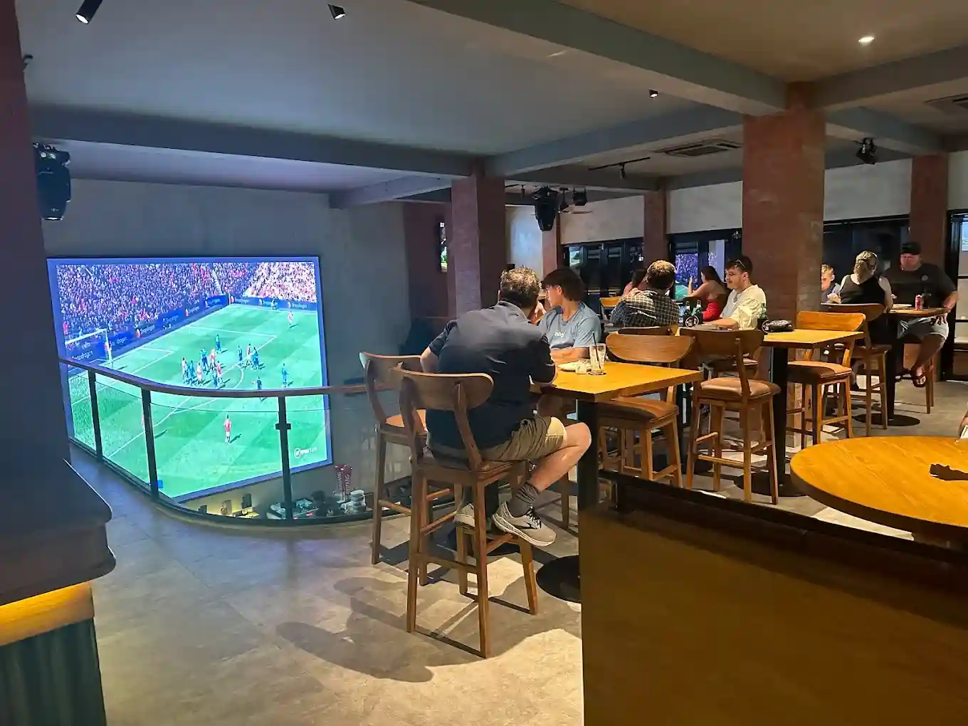 Guests watching live football at Fox & Rabbit Sports Bar Seminyak